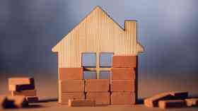 Model wooden house with bricks.