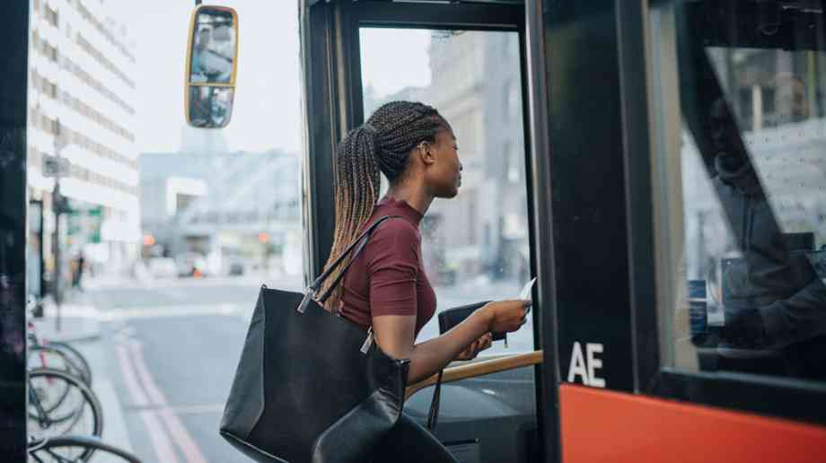 Woman getting on bus