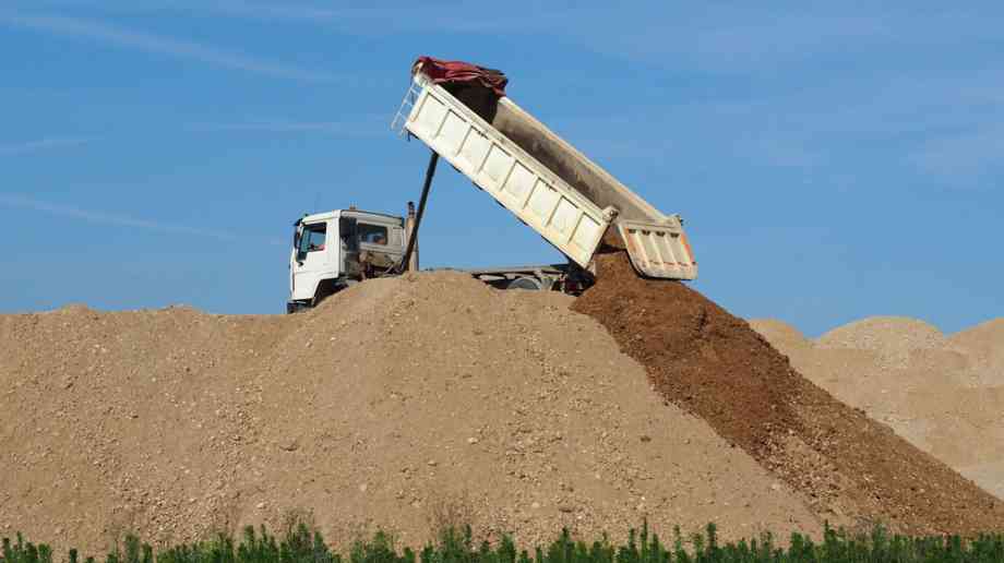 Dump truck depositing soil