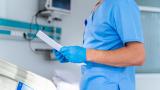 Nurse examining medical records.