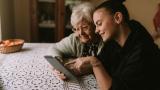 Two women looking at a tablet